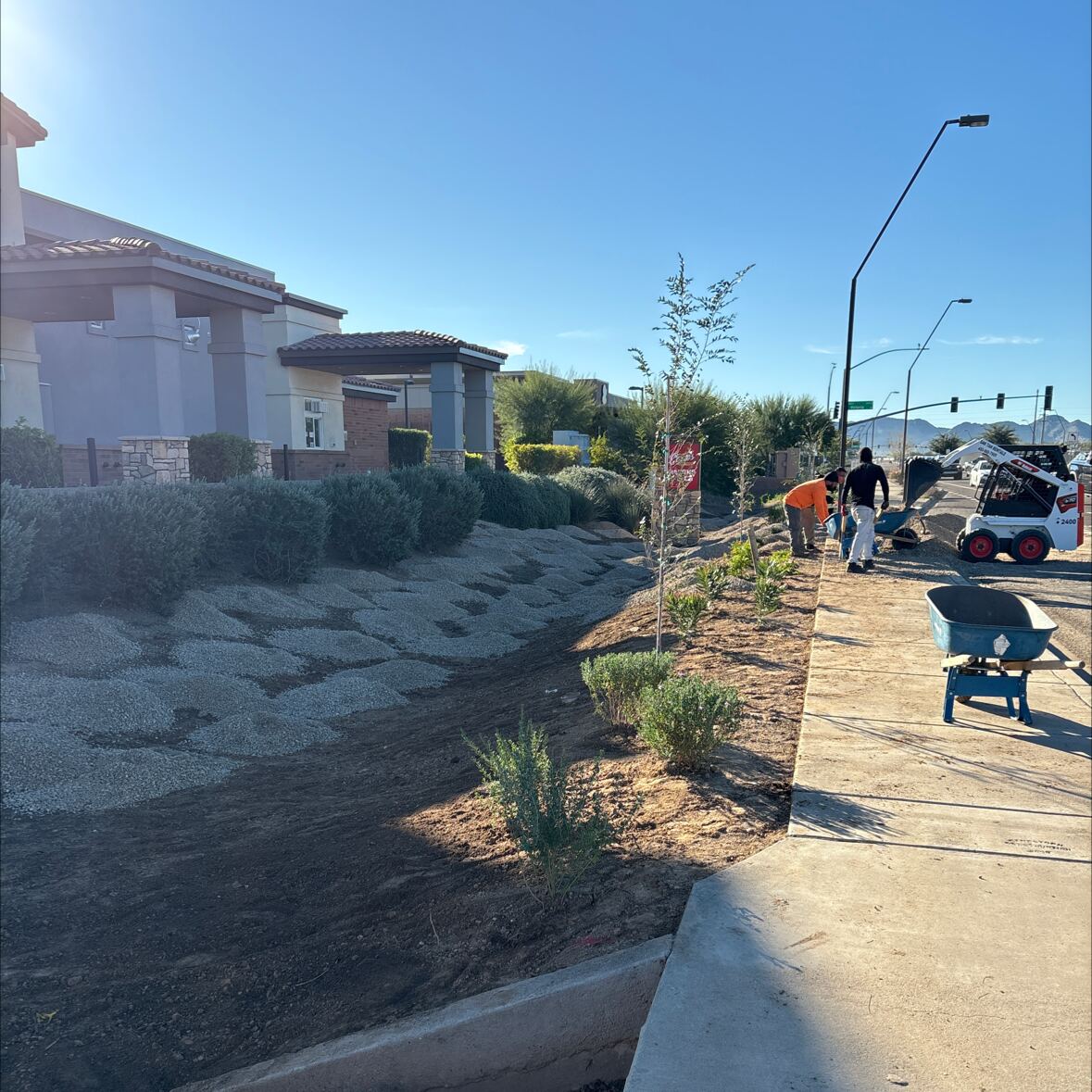 Arizonora Landesign crew installing decomposed granite at a commercial property