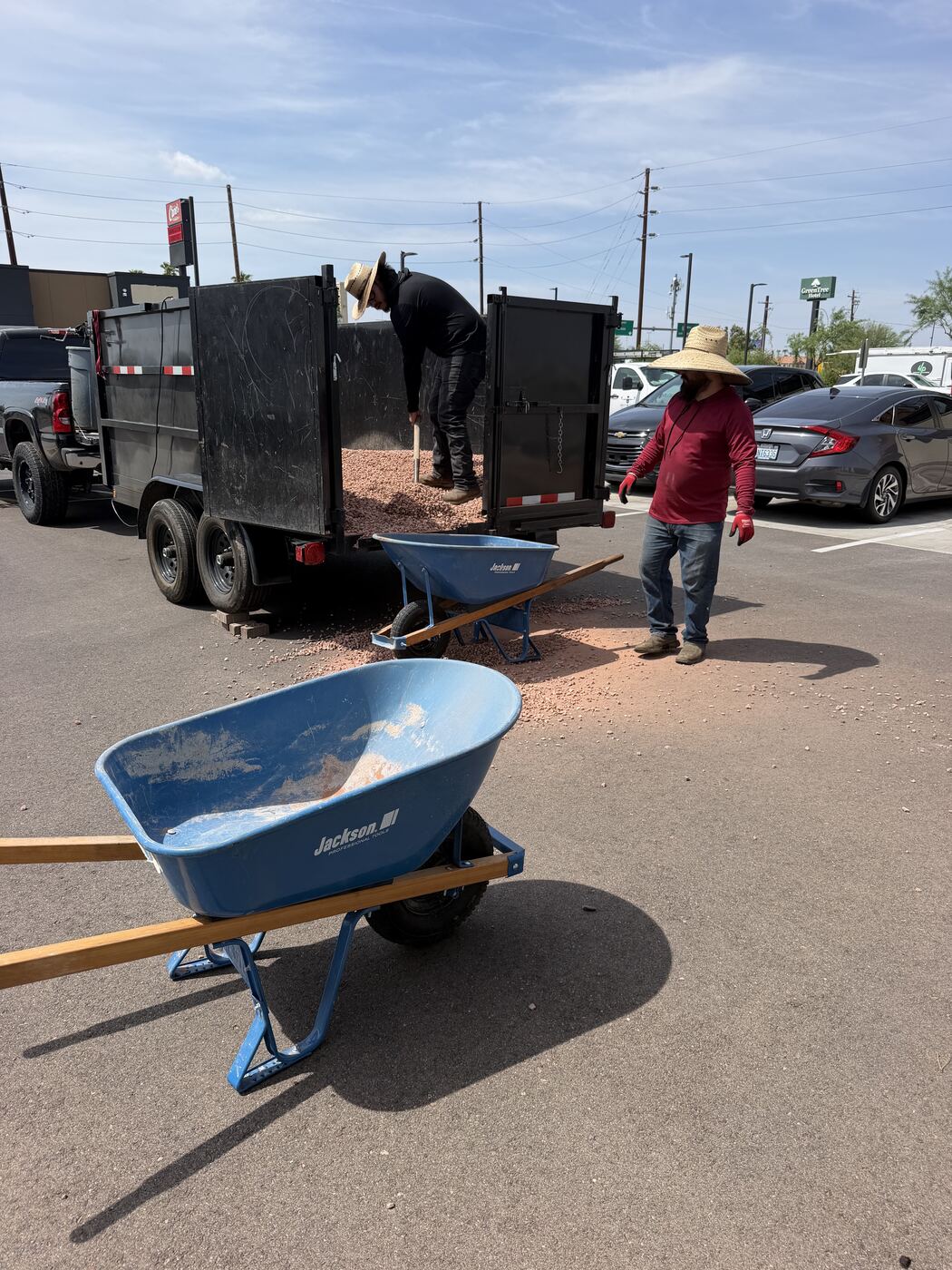 Arizonora Landesign crew moving decomposed granite with wheelbarrows