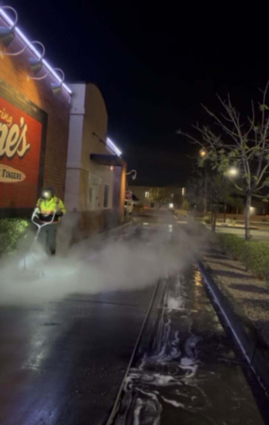 Night power washing of a commercial storefront