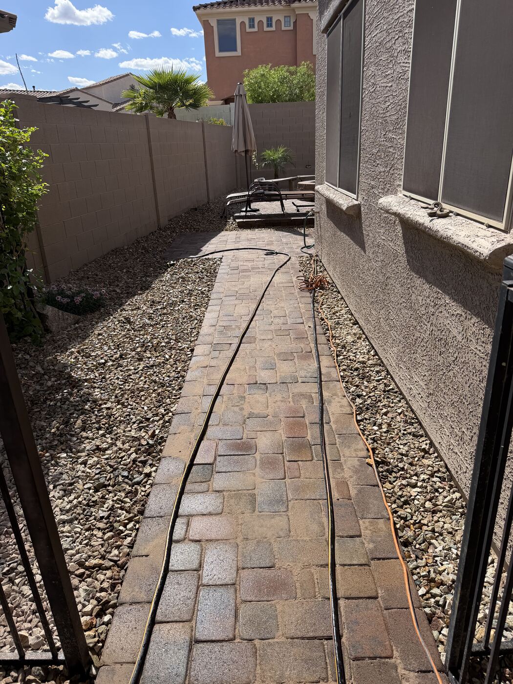 Residential paver walkway with artificial turf